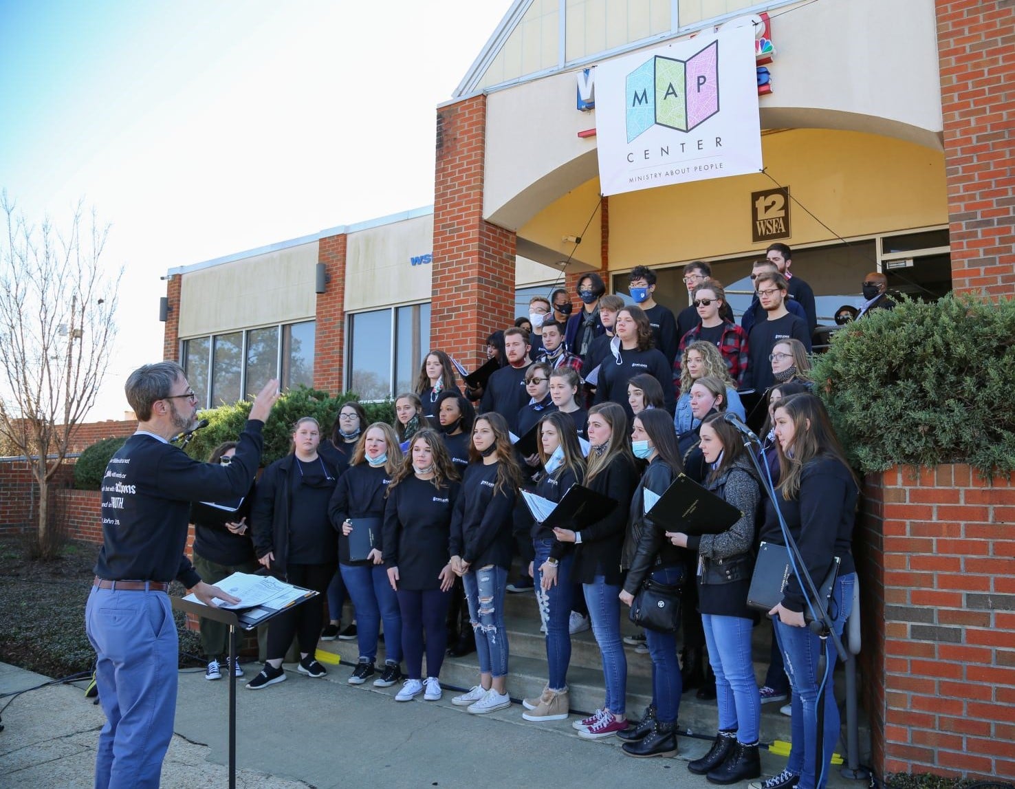 The Faulkner University Chorus sings at a special ribbon-cutting ceremony at Mercy House’s newest location on East Delano Avenue, the former WSFA-TV building on MLK Day, January 18, 2021.