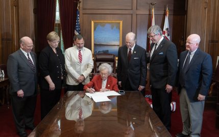 Alabama Governor's Office/Hal Yeager l-r Faulkner Law Dean Charles Campbell, Vallee Connor, Speaker Pro Tem Chris Pringle, Governor Kay Ivey, Senator Jabo Waggoner, Faulkner President Mitch Henry, and John Craft. Governor Kay Ivey signs legislation, HB 96 on May 6, 2026.
