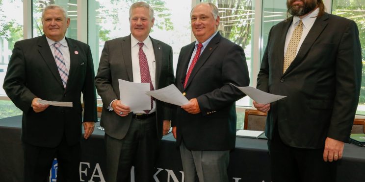 l-r Commissioner Rick Pate, Faulkner President Mike Williams, Federation President Jimmy Parnell, and NALC Director Harrison Pittman pose after signing a memorandum of understanding to establish a three-year Alabama Ag Law Pathway.