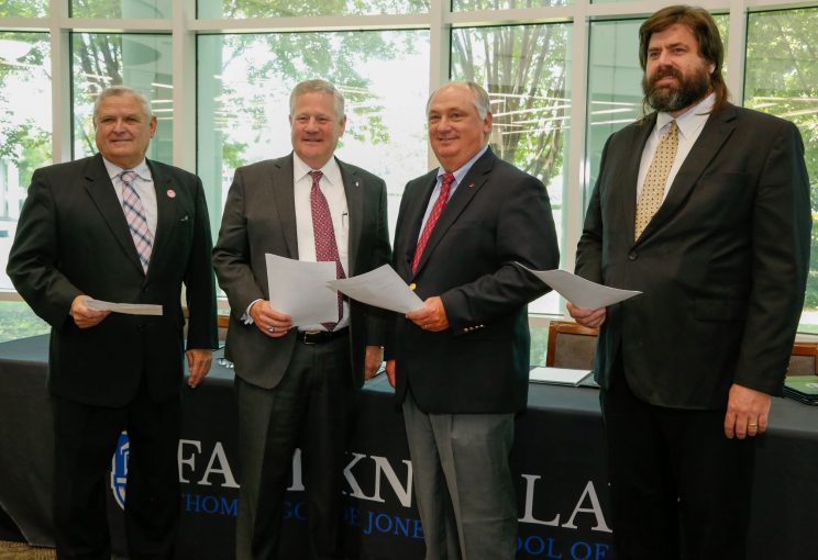 l-r Commissioner Rick Pate, Faulkner President Mike Williams, Federation President Jimmy Parnell, and NALC Director Harrison Pittman pose after signing a memorandum of understanding to establish a three-year Alabama Ag Law Pathway.