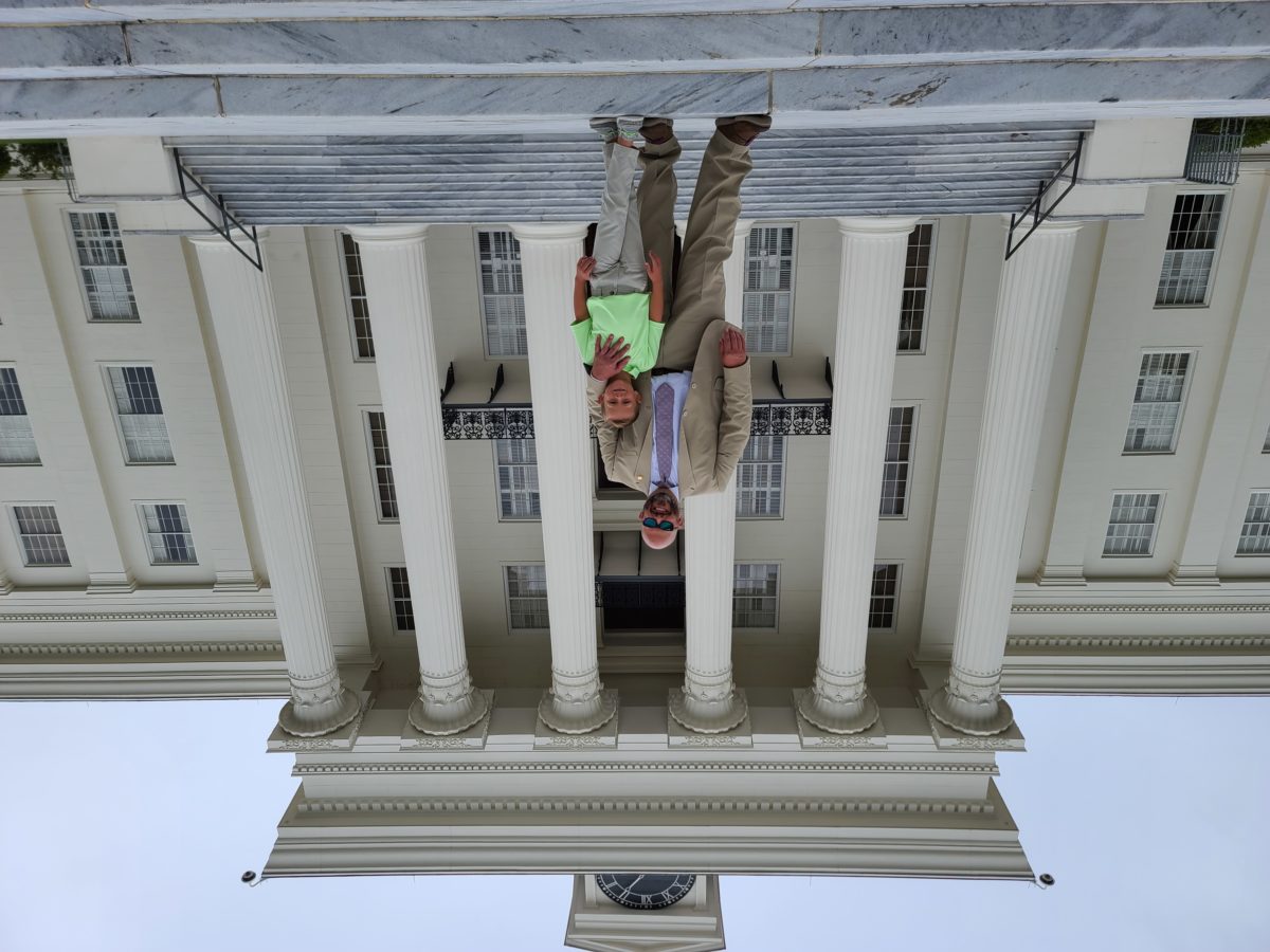 DA Jeremy Duerr and his son Stephen. on the steps of the state capitol. 