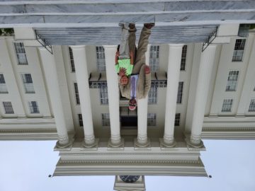 DA Jeremy Duerr and his son Stephen. on the steps of the state capitol.