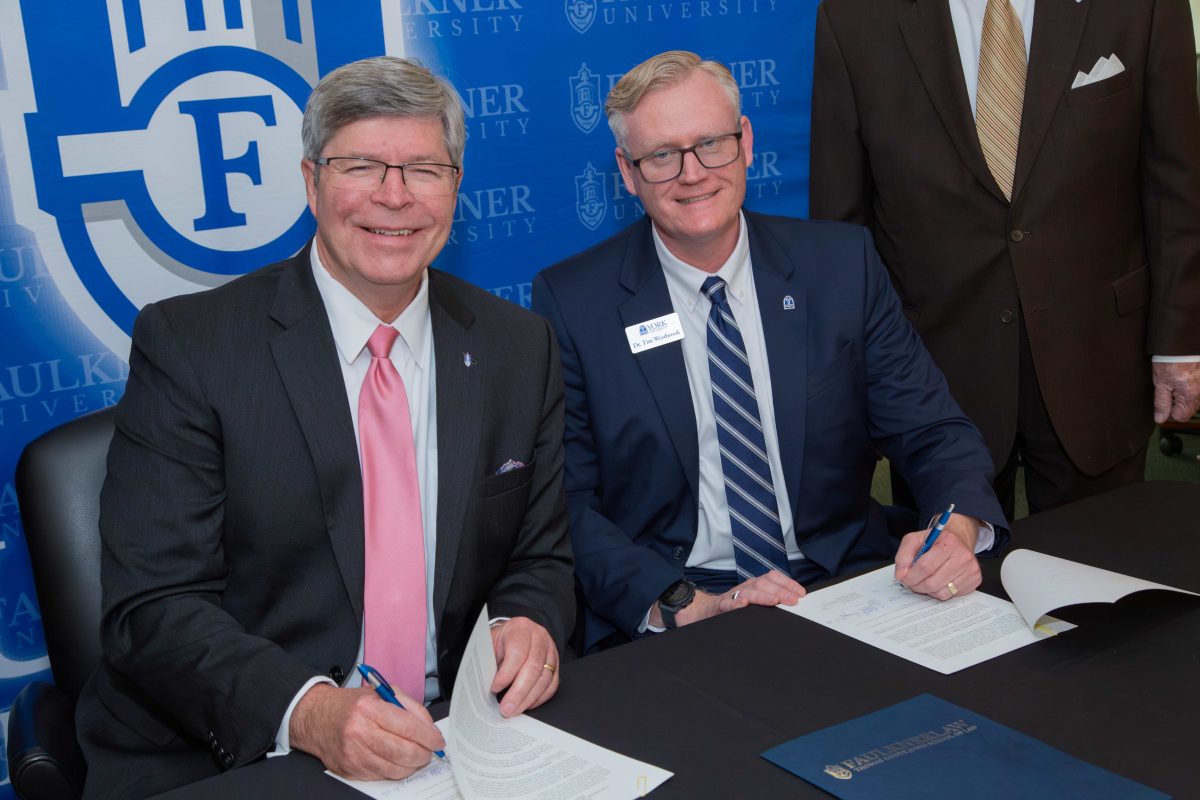President Mitch Henry and York University President James Westbook sign "3+3" agreement.