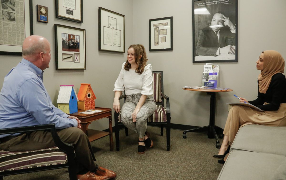 l-r Faulkner Law professor John Craft, and 3L law students Whittney Clark and Wala Hijaz pose for a mock client meeting at the Faulkner Law's Elder Law Clinic lobby