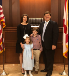 Andrew Hamlin poses with his wife and two children.